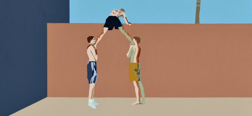 Several youths hoist their friend over a garden wall